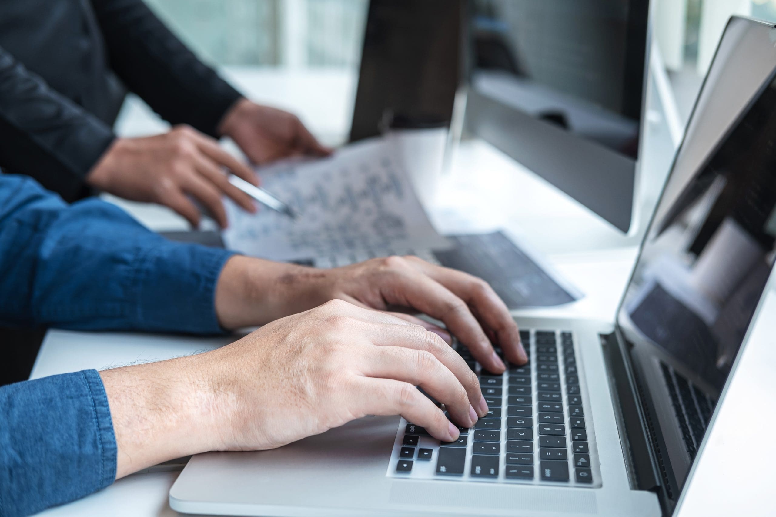 Typing on a laptop